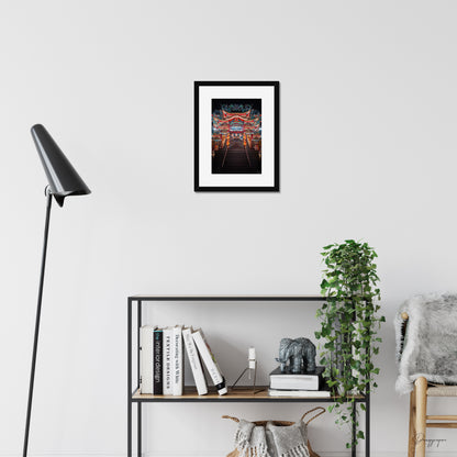 Mockup of wall art showing a small black wooden frame that is hanging on the wall of a living room and contains a photo of a very impressive Taoist temple during the night in Taipei Taiwan