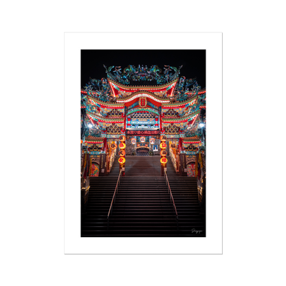 A fine art print showing a very impressive Taoist temple with lights that are glowing in the night in Taipei Taiwan