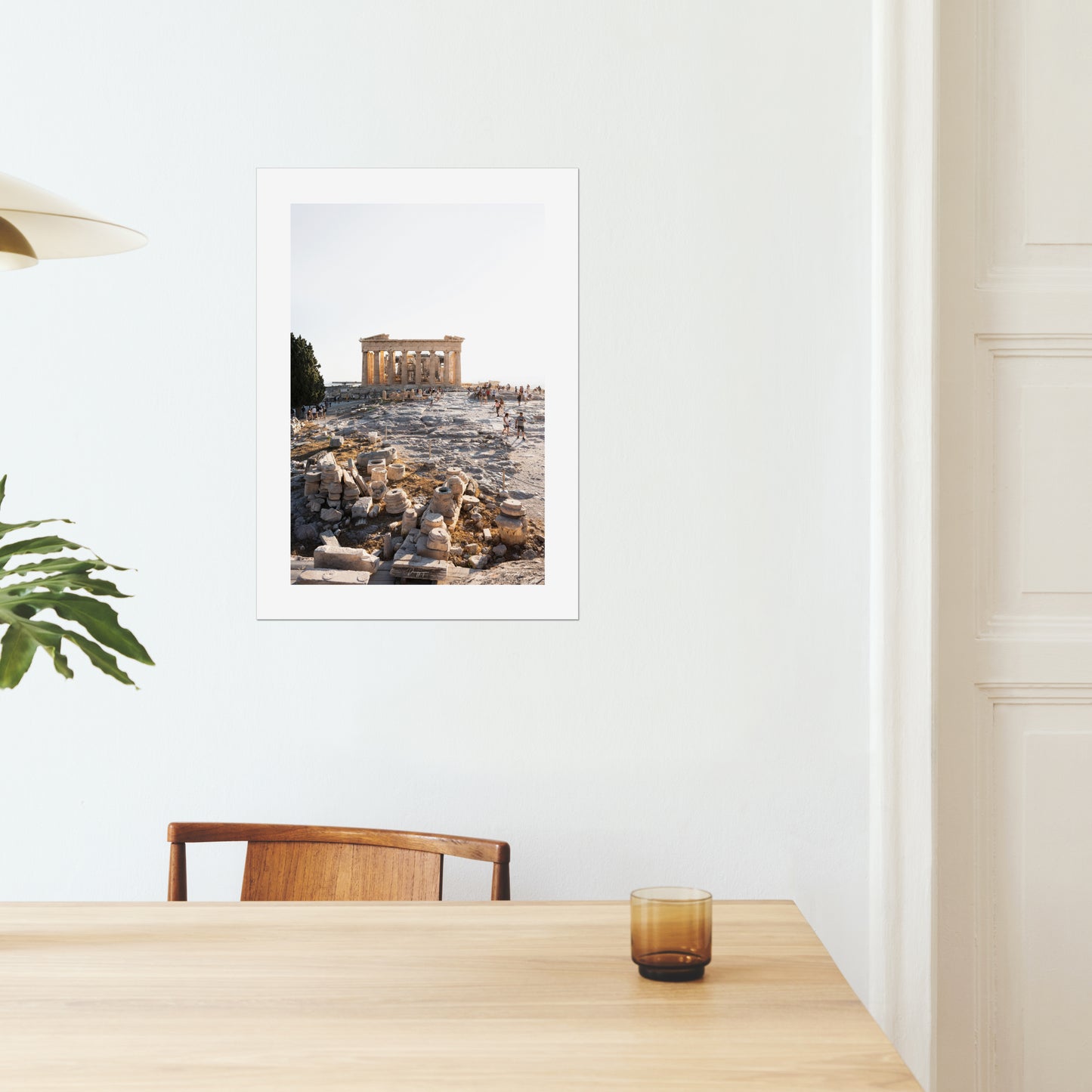 A mockup of a big poster on the wall of a dining room showing the Parthenon on the hill of Acropolis in Athens Greece during a bright warm day